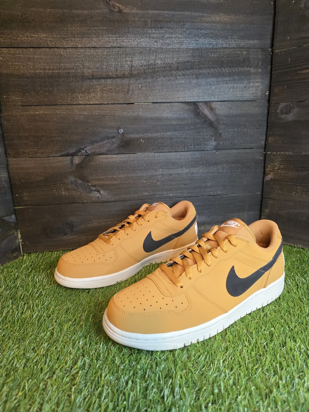 Nike Men's Low-Top Sneakers in Orange with Black Swoosh